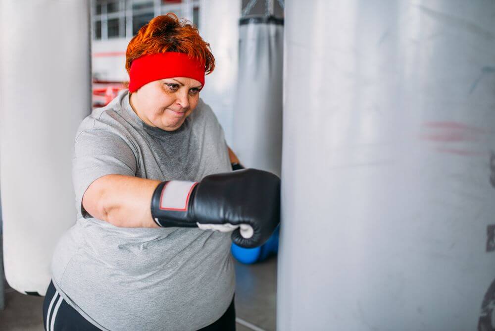 fat woman in boxing gloves